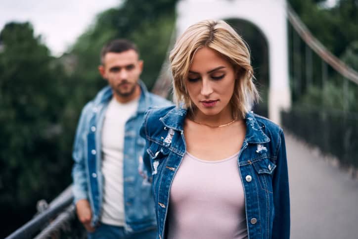 couple in denim on the bridge