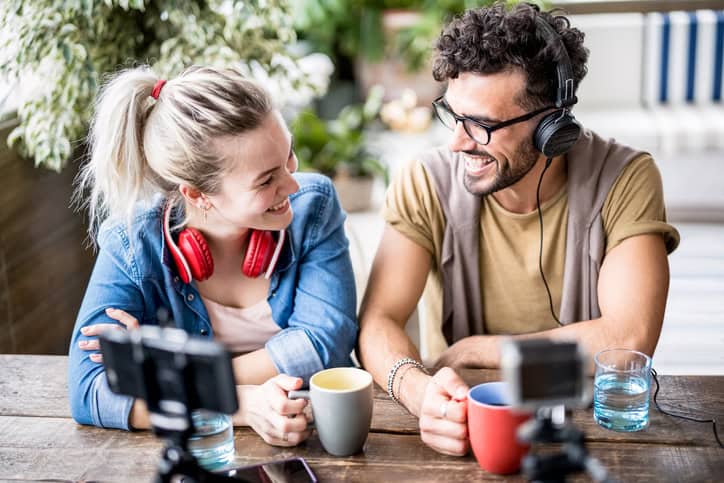 couple laughing and drinking coffee