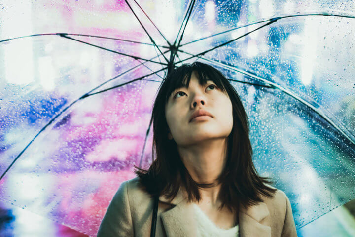 Asian young woman with umbrella