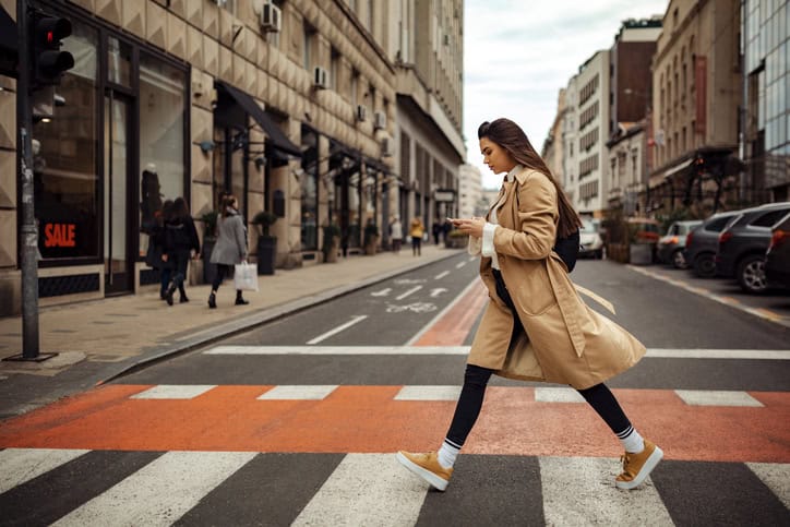woman outside crossing the street