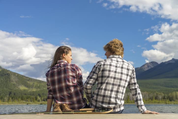 couple sitting on dockside