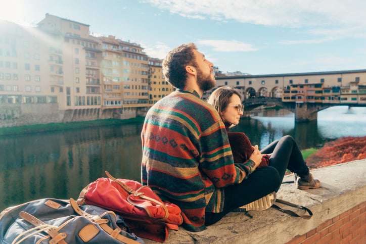 Young heterosexual couple resting with view