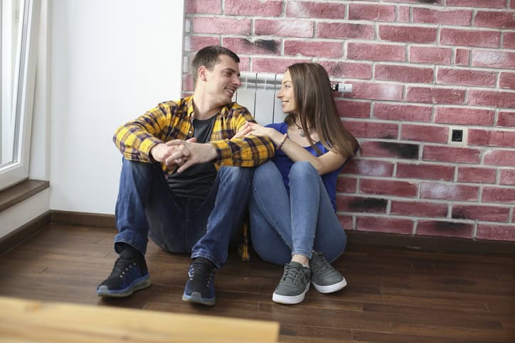 couple sitting on the floor talking