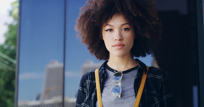 African american woman standing near a window