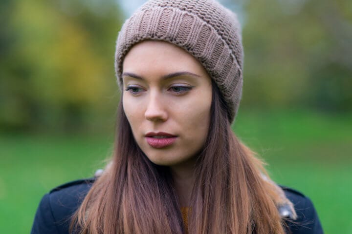 Portrait of young woman in the autumn forest