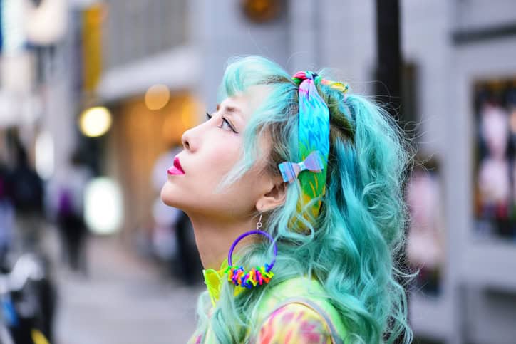 asian woman with bright hair color