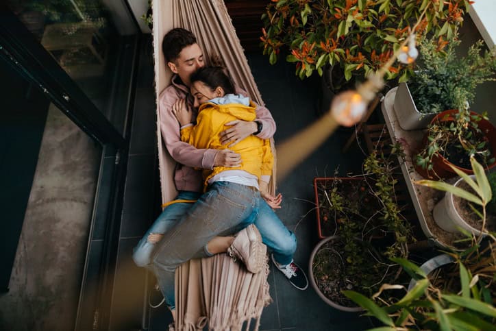 couple laying on hammock