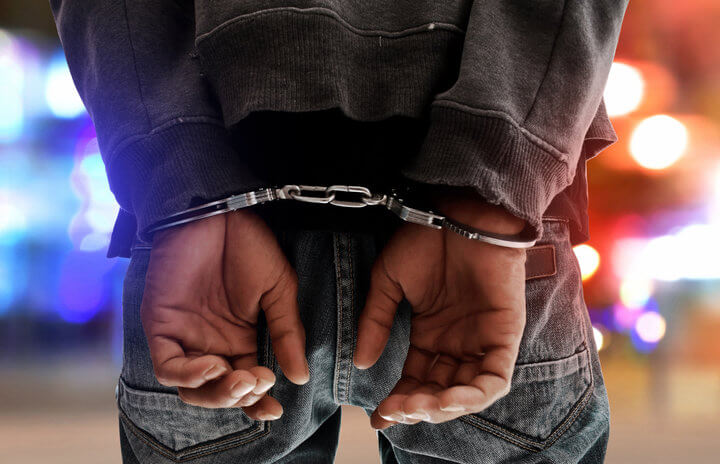 Man in handcuffs.