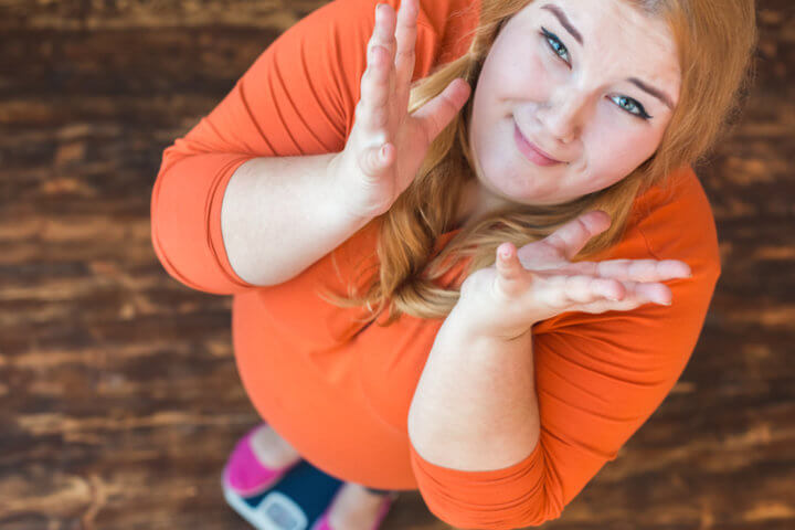 Overweight Woman standing on scales