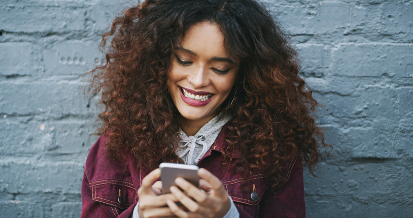 Woman using her cellphone.