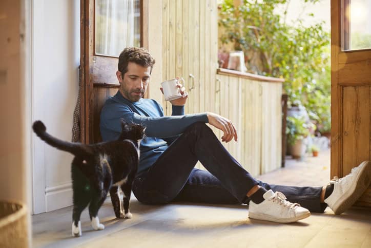 Man being lazy with his dog.