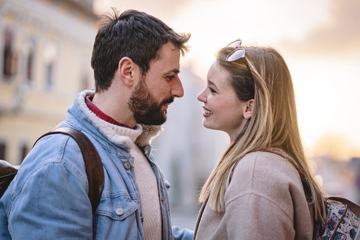 couple outside gazing into eyes