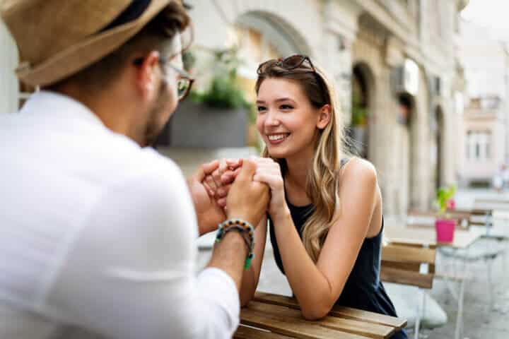 young couple holding hands