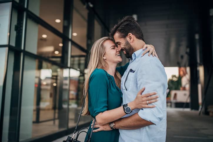 man looking adoringly at a woman inside