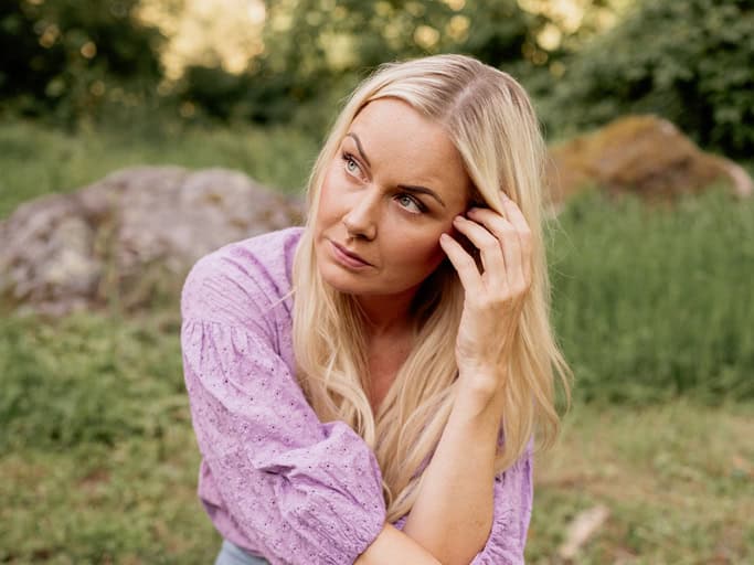 woman outdoors contemplating life