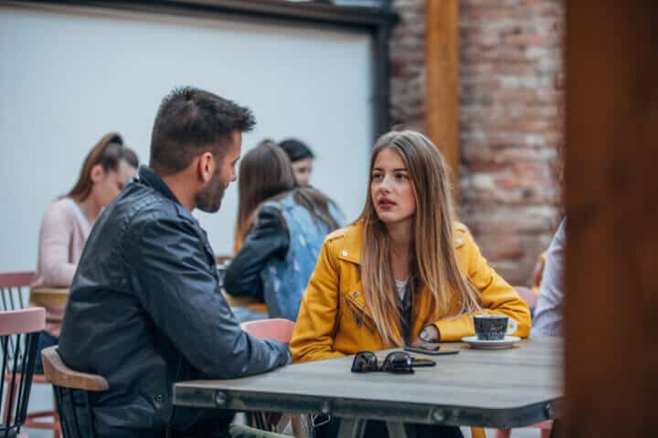 couple having differences sitting outside
