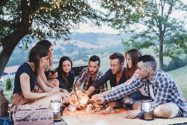 Large family gathering outdoors.