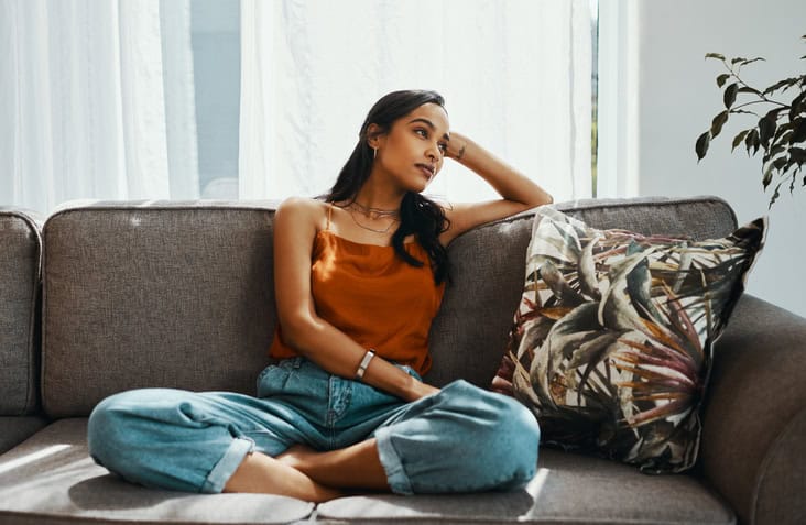woman sitting alone on the couch