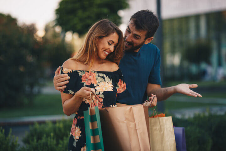 woman and man with shopping bags