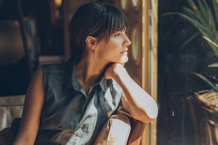 woman looking out of the window