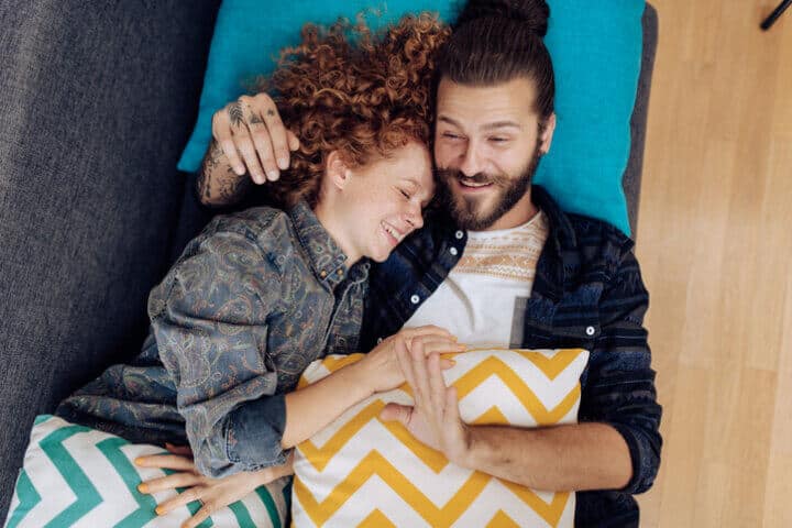 above camera couple laying in bed
