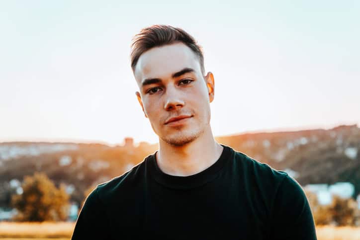 Young caucasian man standing outdoors