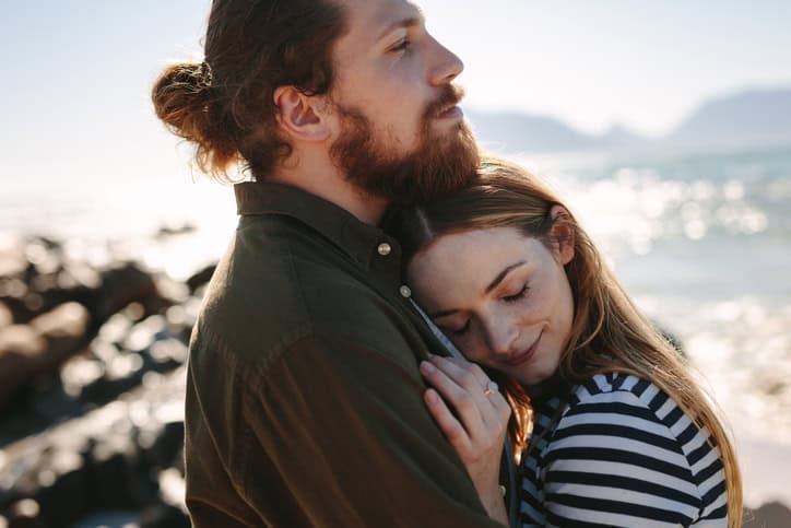 couple hugging on the beach