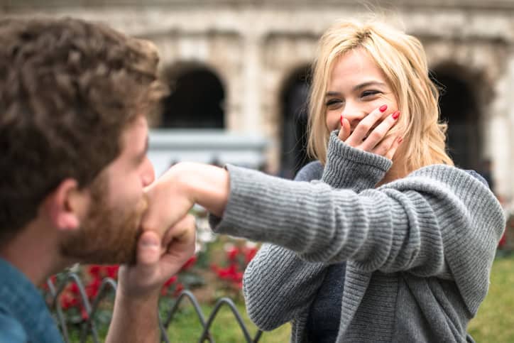 guy kissing woman's hand
