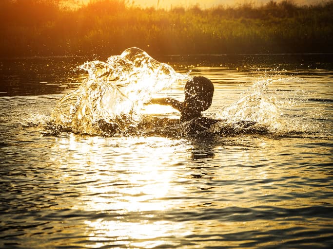 woman swimming in a river