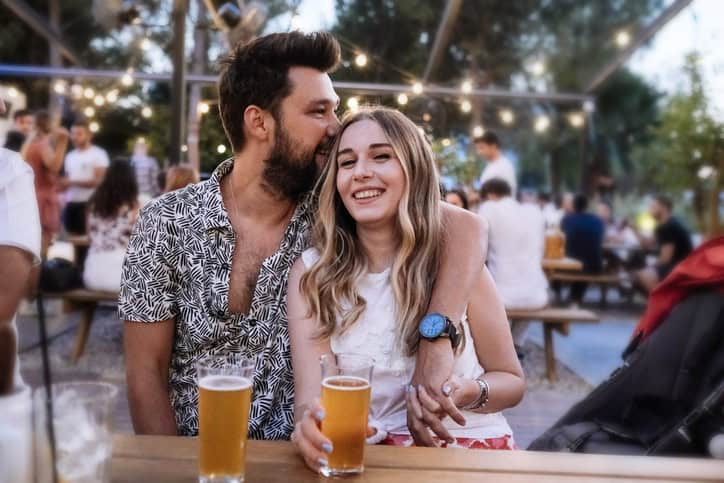 couple sitting outside at a bar