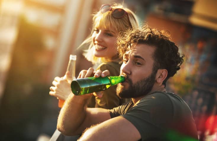 beer drinking couple outside