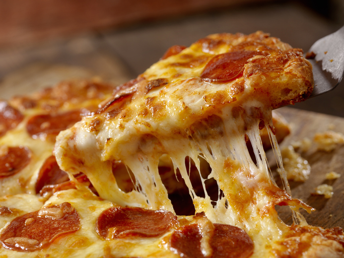 A cheesy pizza slice.