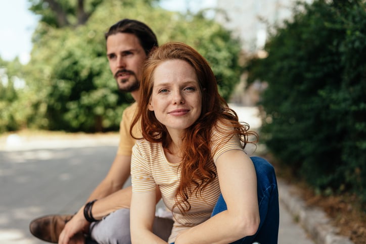 An independent woman in a relationship pulling away from her boyfriend