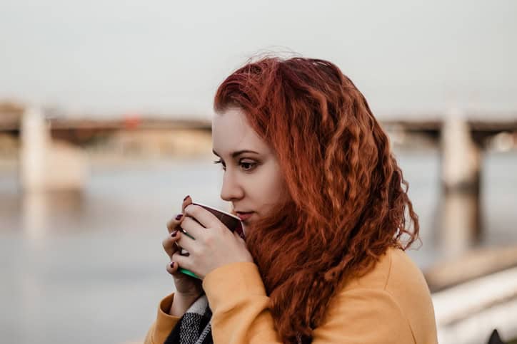 girl dreadlocks drinking coffee