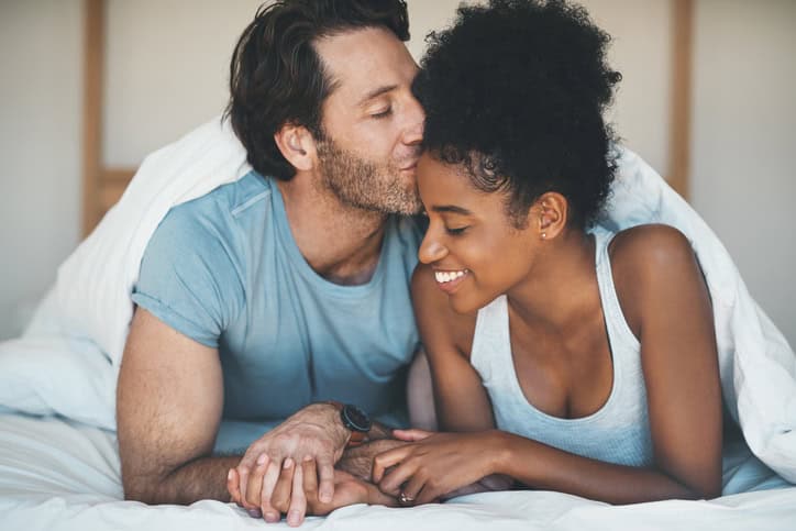 mixed race couple in the bedroom