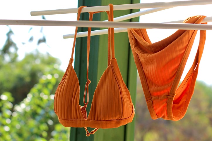 Orange bikini on a washing line.