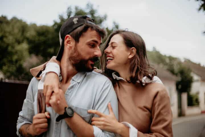 romantic couple about to kiss outside autumn day