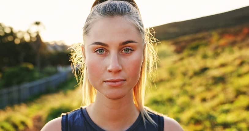 blonde running stopped looking camera