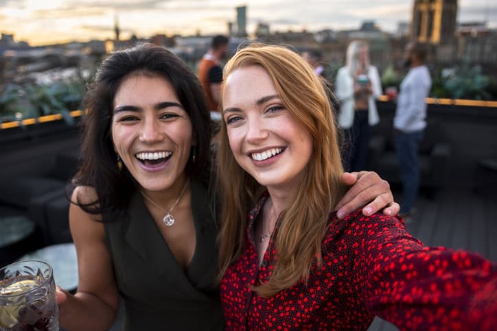best friends at rooftop party