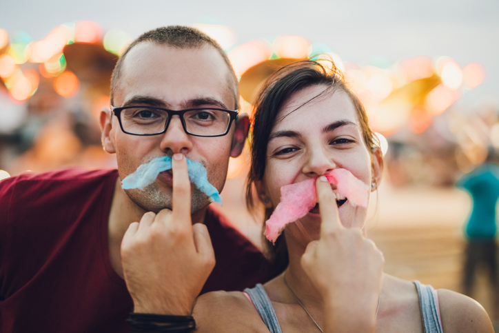Happy couple in an amusement park.