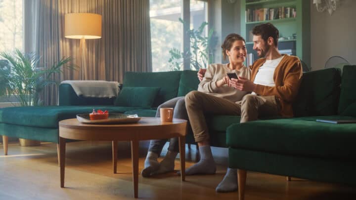 couple cuddling up on couch
