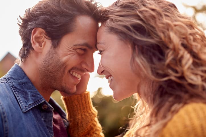 couple smiling and kissing