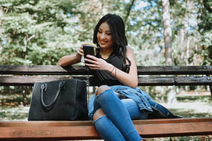 woman sitting alone on a bench