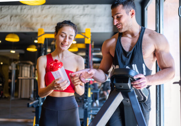 couple flirting at gym