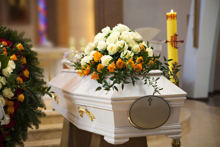 A white coffin in the church.