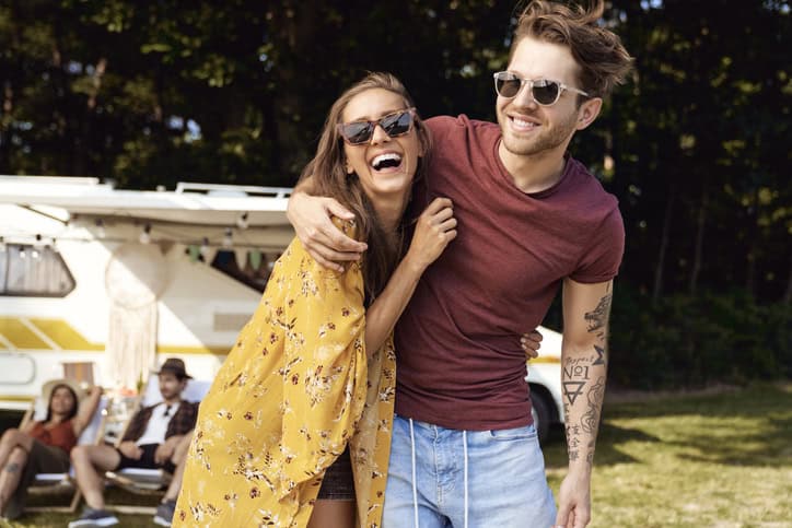 young couple hugging outside