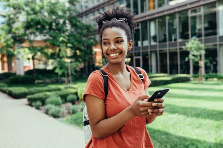 african american woman holding a smartphone