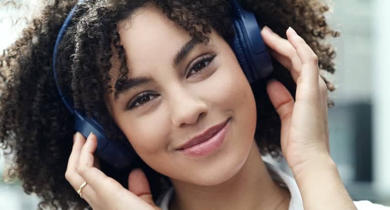 Woman listening to her headset.