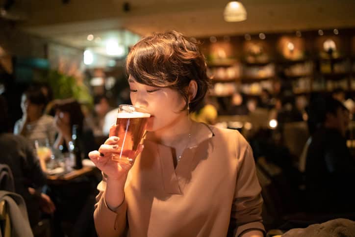 asian woman drinking beer