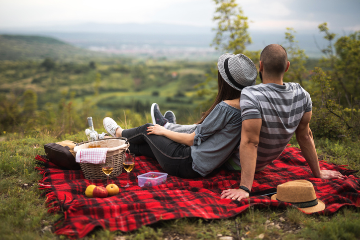 Couple having an outdoor picnic.